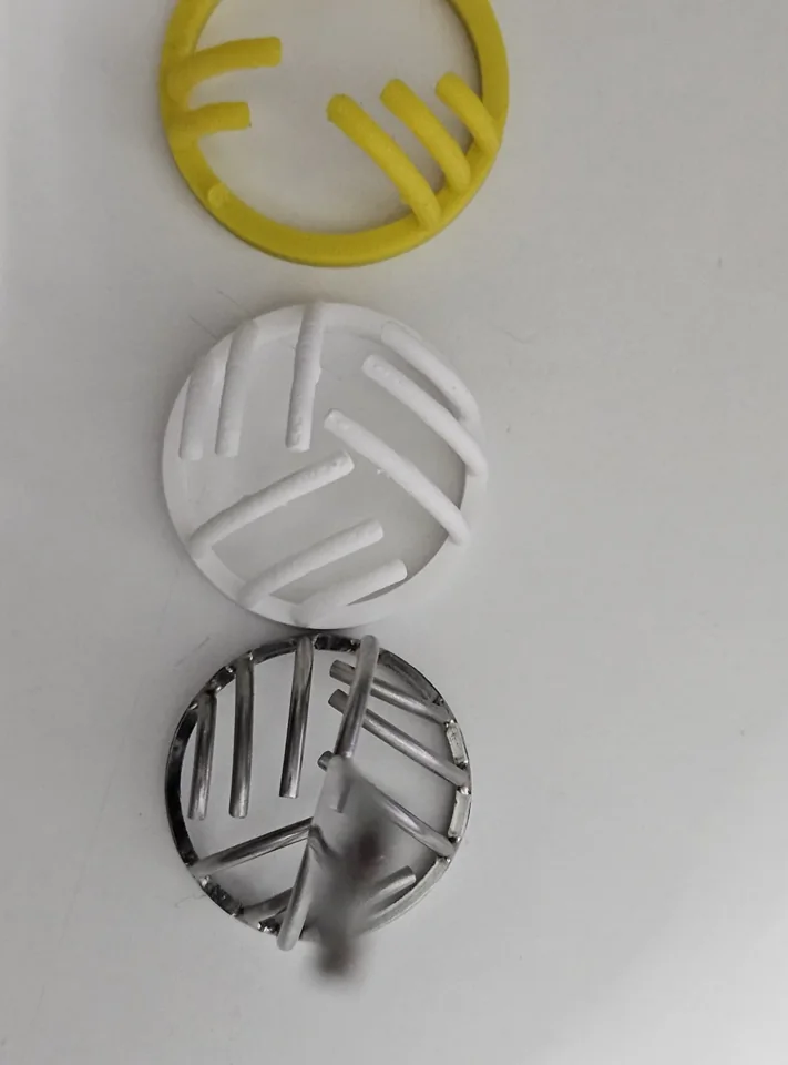 Yellow PETG head, white PLA head and original metal tool arranged in a row.