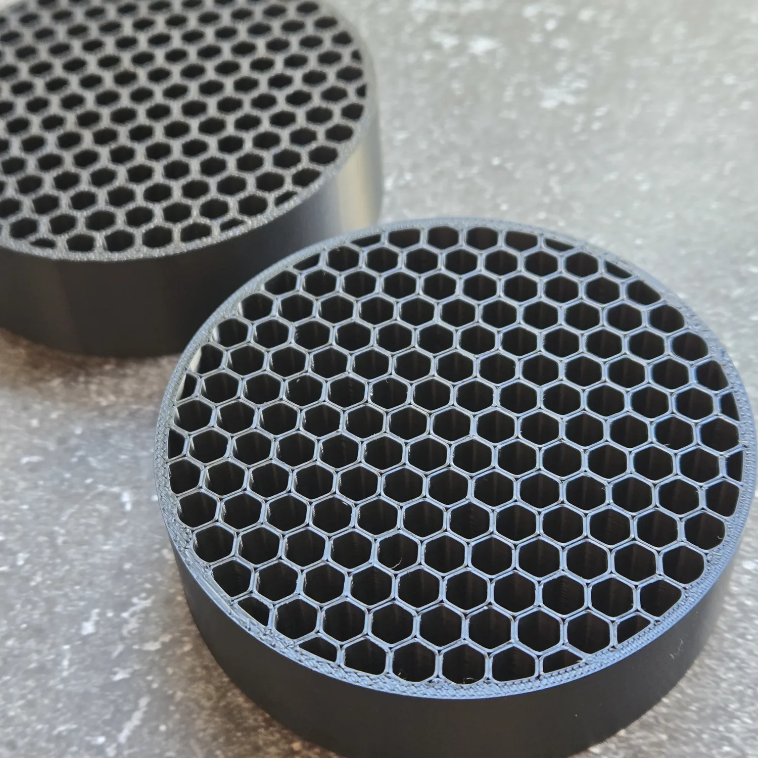 Two custom black ASA intake flow straighteners shown from the front.