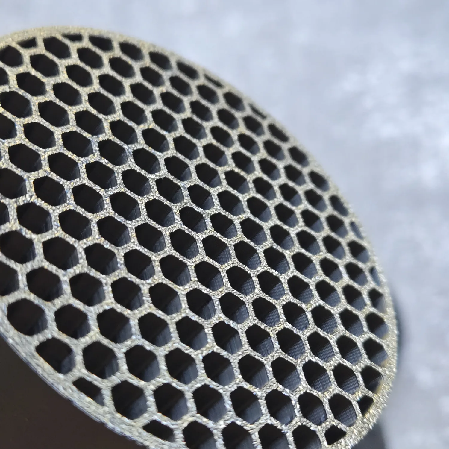 Close-up view of the honeycomb cells on the custom ASA intake insert.