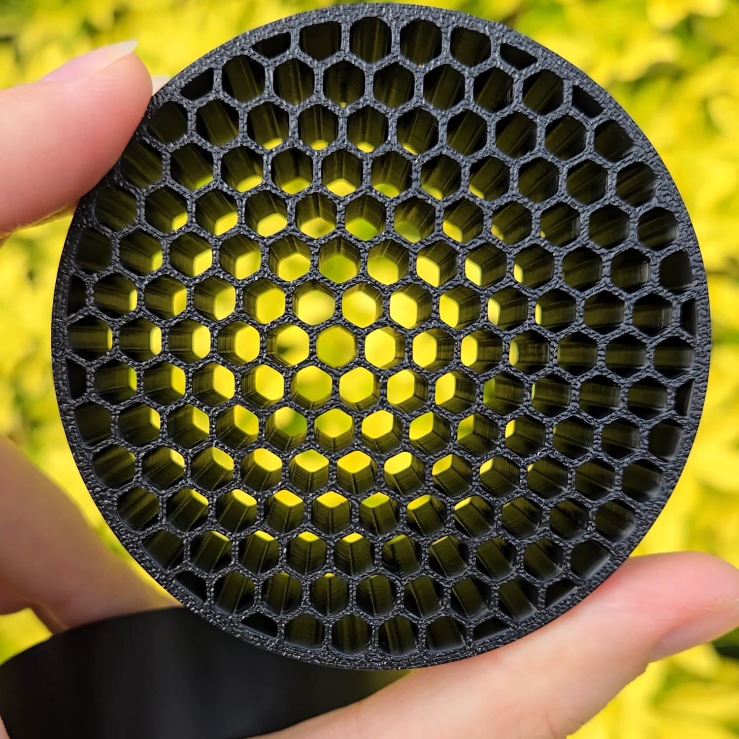 Light shining through the honeycomb structure of the intake flow straightener.