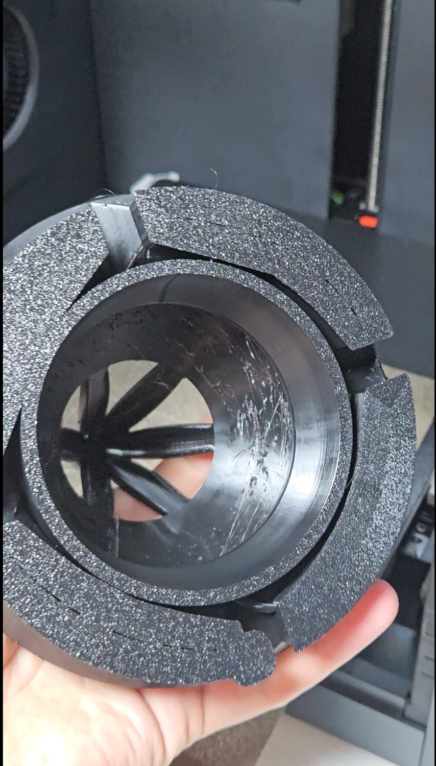 Inside of the custom vent cowl showing the support-contact area in hand.