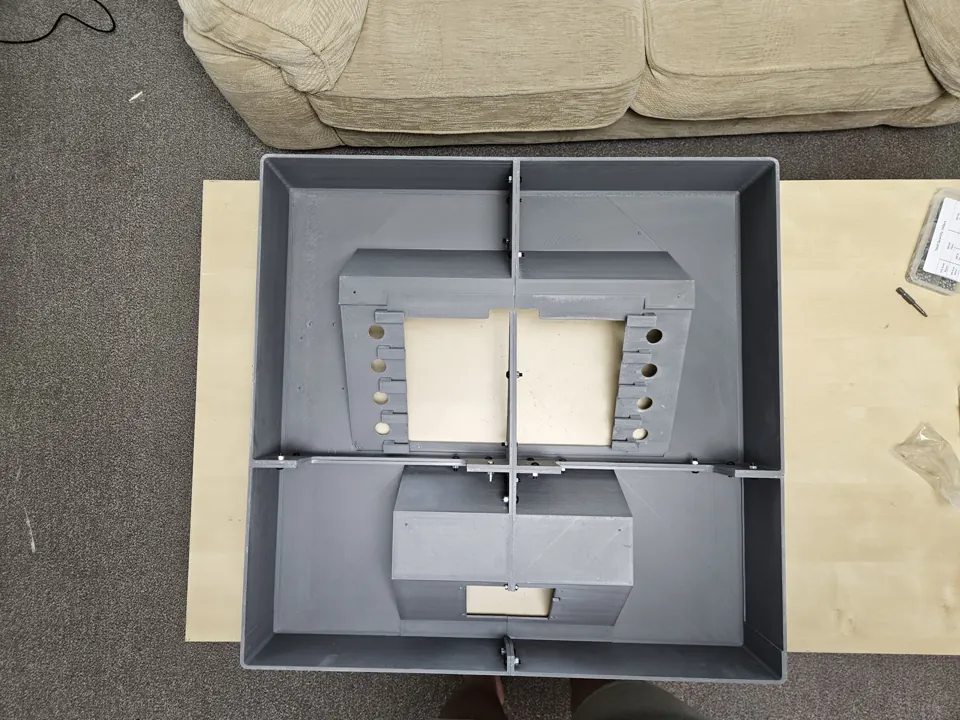 Rear of the assembled empty enclosure showing internal divisions and fasteners.