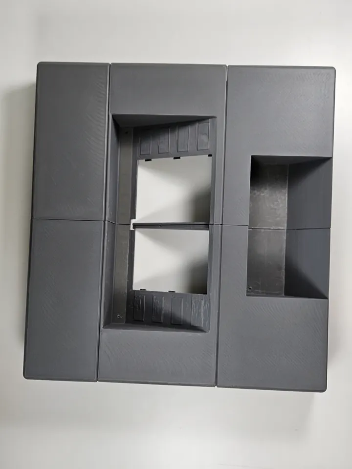 Initial grey enclosure assembled from six main printed sections.