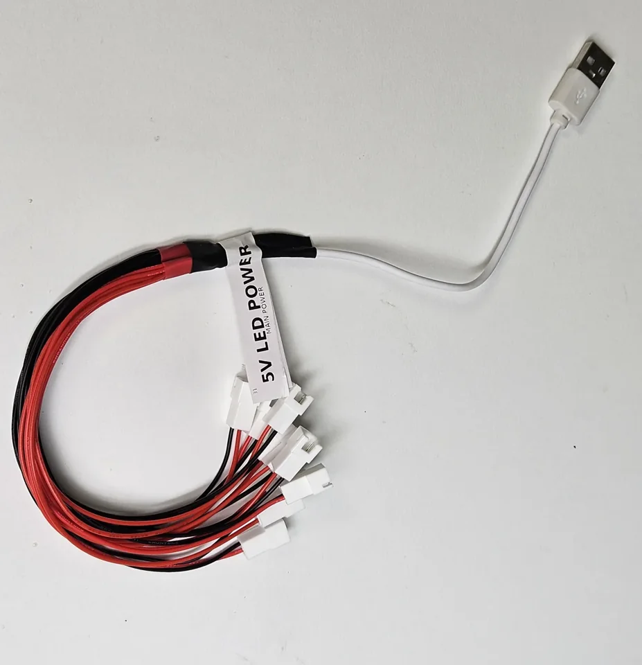 USB cable branching into labelled power connectors for button LEDs.