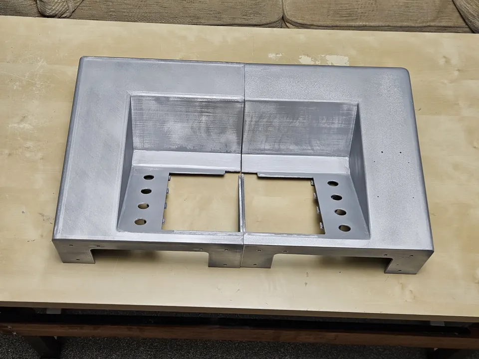 Painted enclosure body assembled on a work table before the controls were installed.