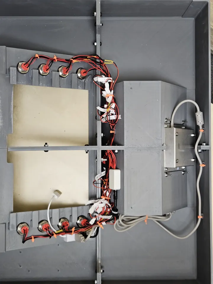 Open rear of the enclosure with button wiring installed and no tablet fitted.