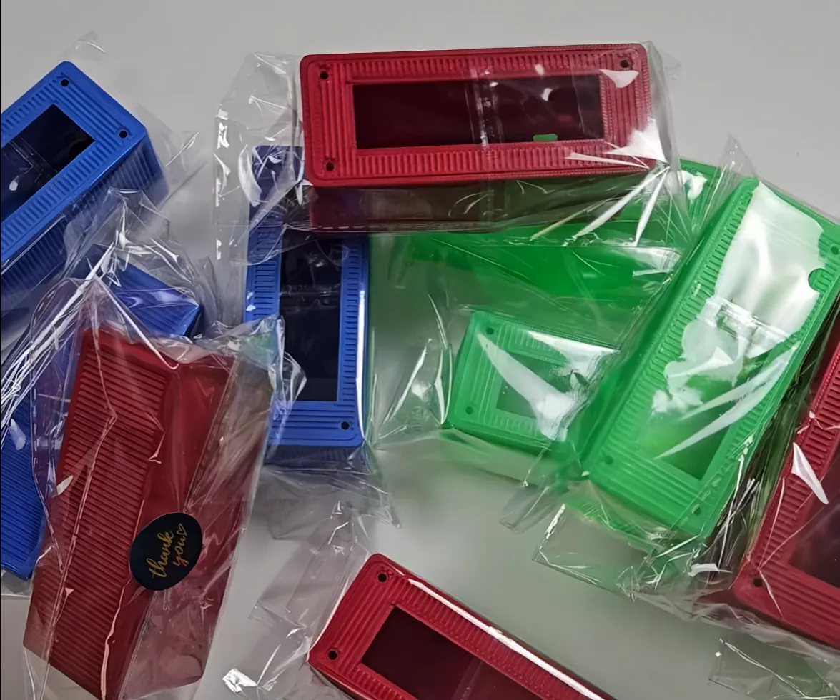 Test enclosure variants printed in different colours and packed in clear bags.