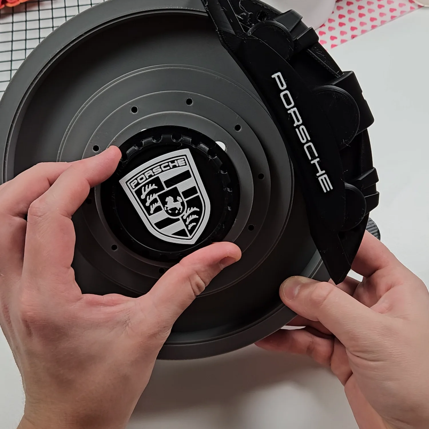 Test fitting the personalised centre cap and caliper onto the printed brake disc lamp.