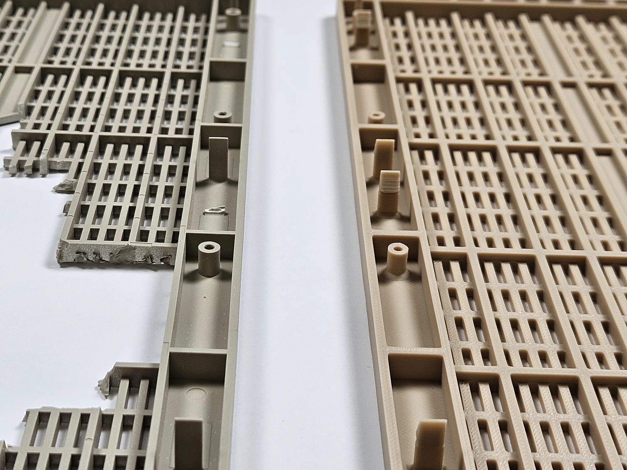 Close-up comparison of the broken original radio front cover and the newly printed replacement.