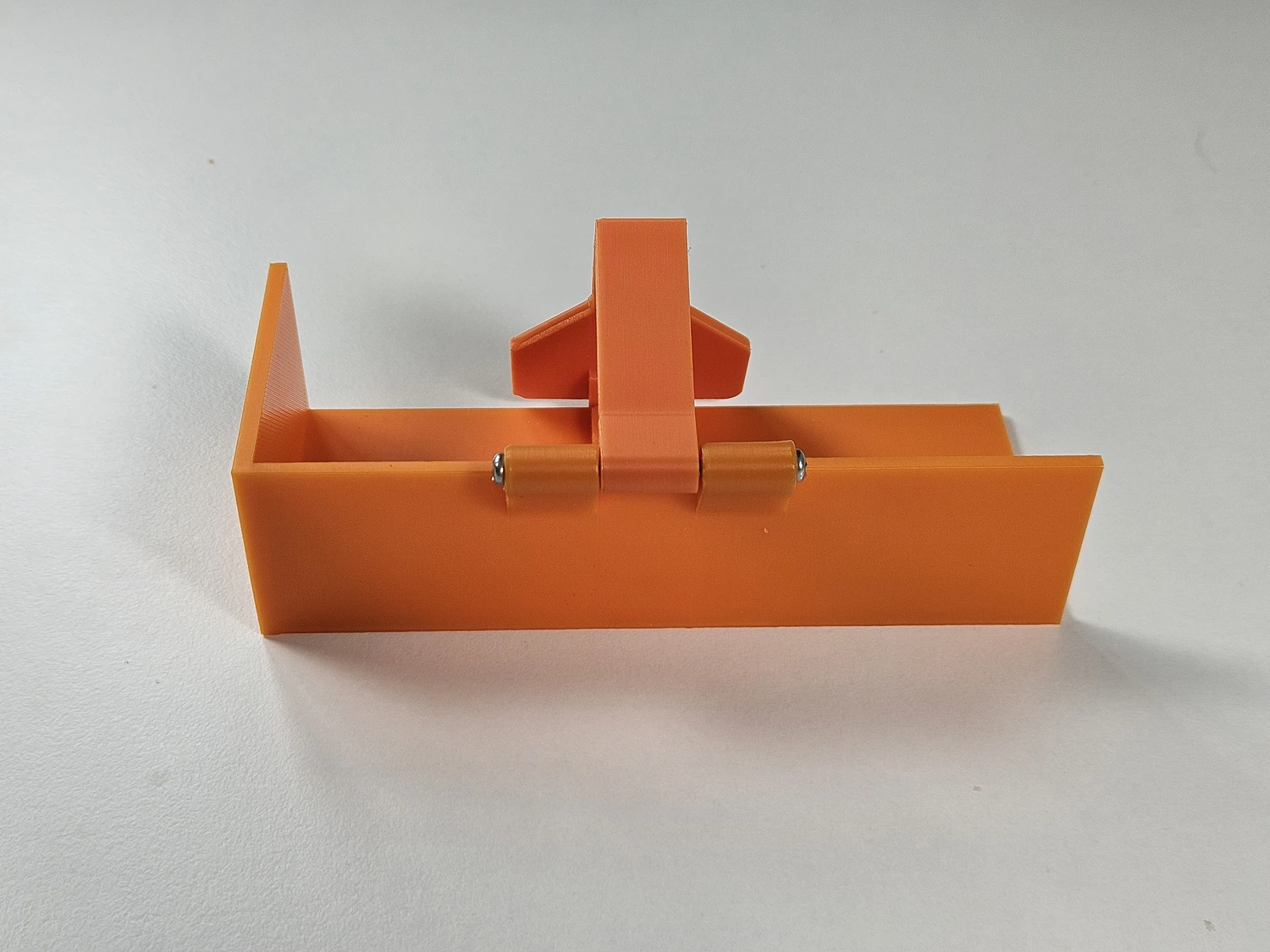 Assembled Ryobi battery removal tool viewed from the side.