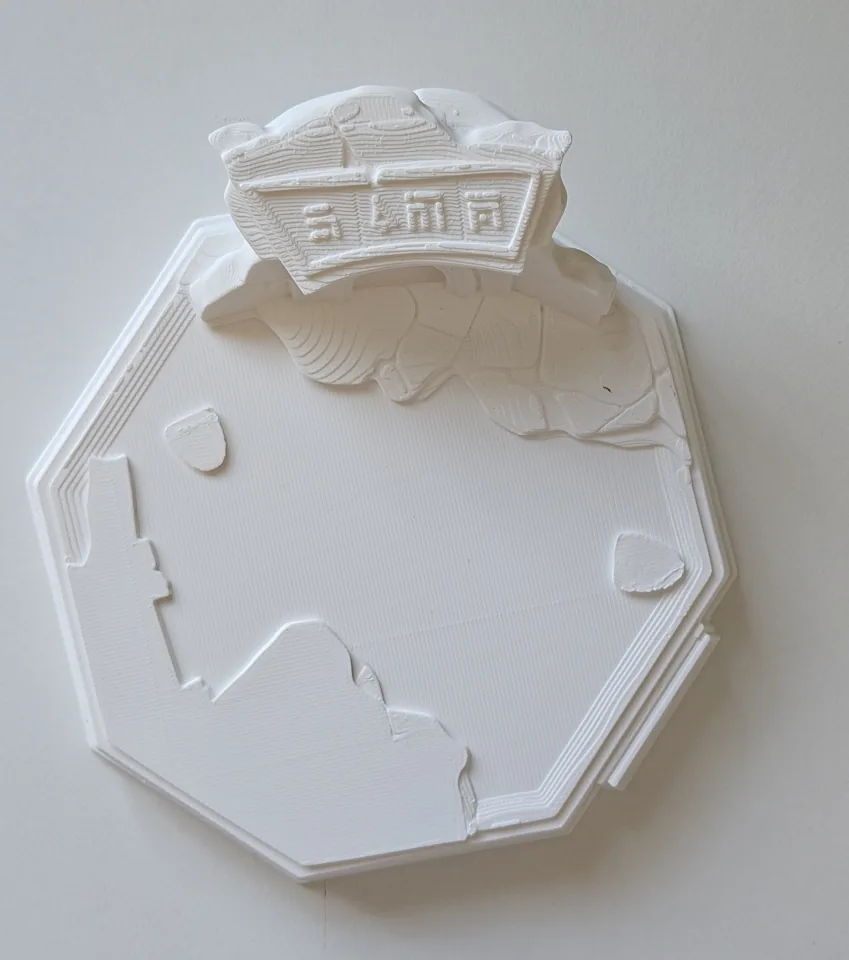 White printed display base with an open centre and sculpted edge details.