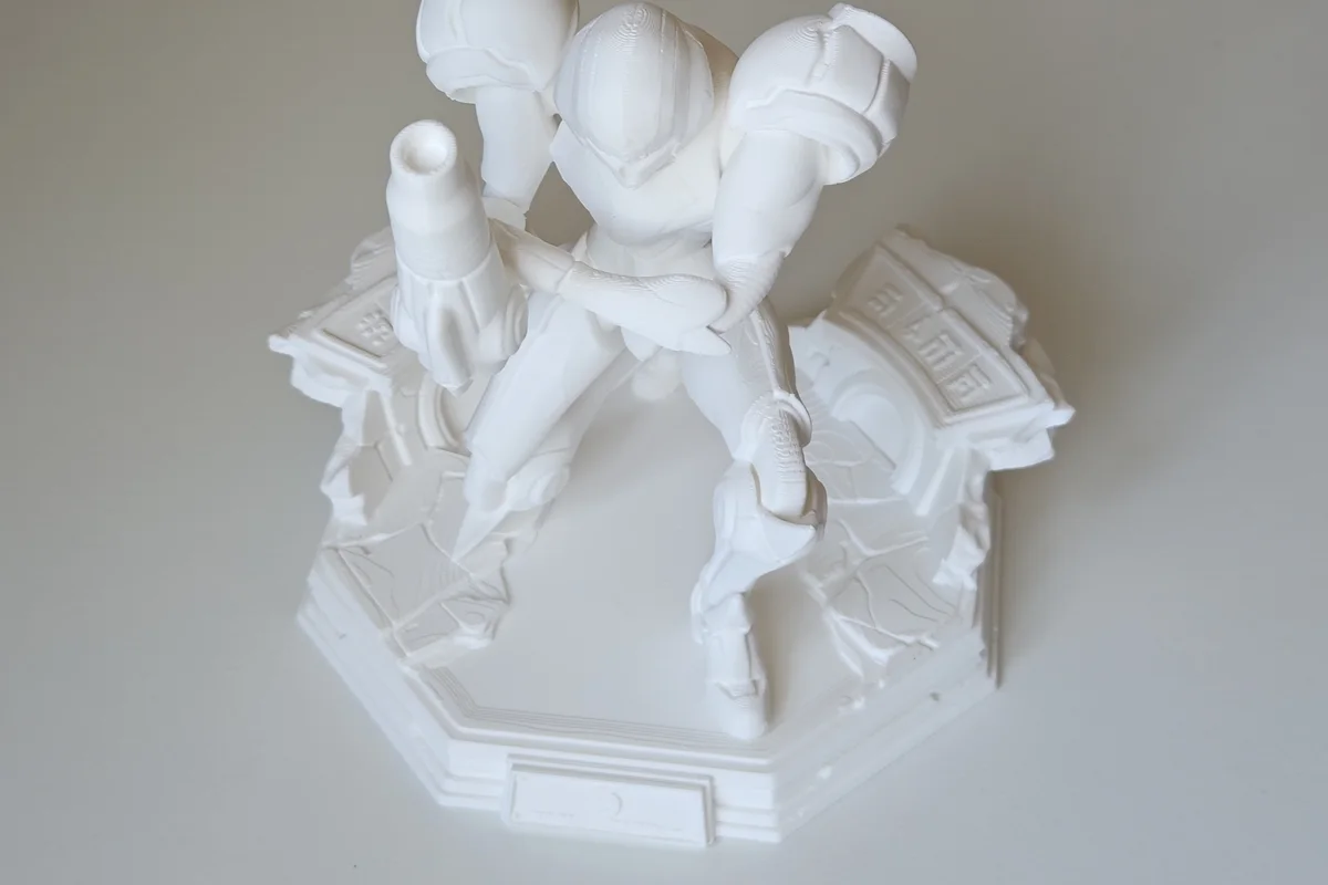 Assembled white character statue and scenic base.