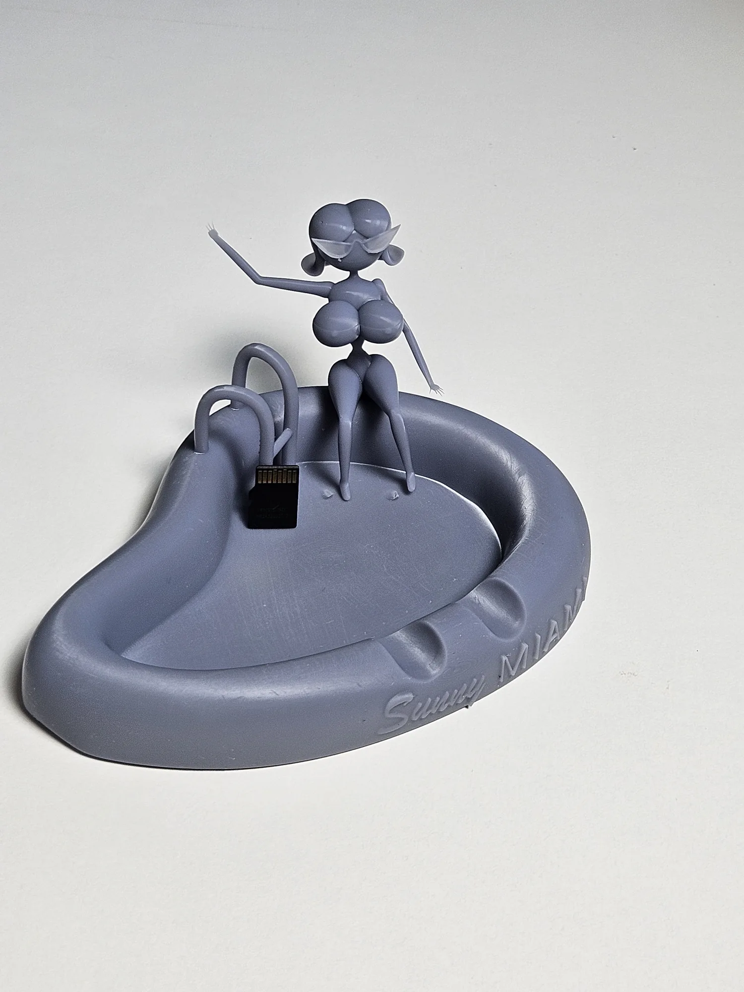 Sunny Miami miniature shown next to a microSD card for scale.