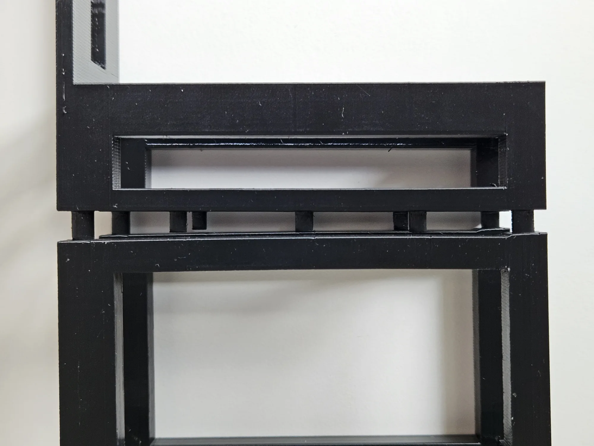 Close view of the joining area between the front panel sections and the open basket.