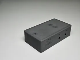 Assembled black PLA enclosure printed from a supplied model.