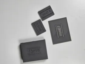 Detail of the printed small-hole test pieces.