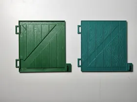Original toy door alongside its 3D printed replacement.