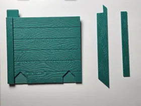 Printed door components with the wood-grain texture and separate slats.
