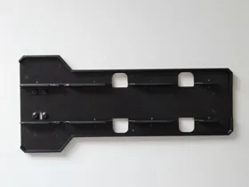 Inside face of a printed RC chassis component.