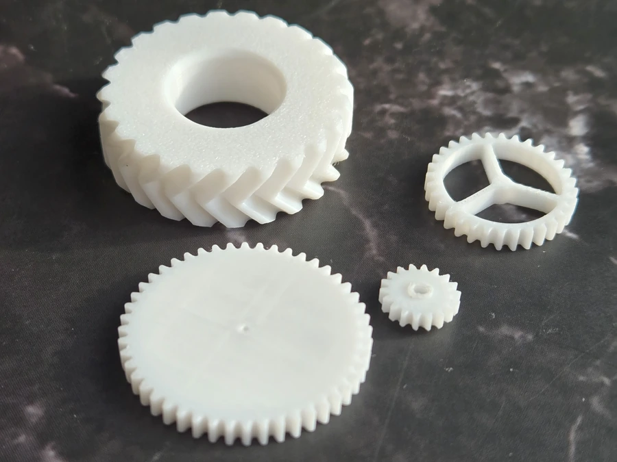 FDM printed gears shown close up as a functional mechanical print example.