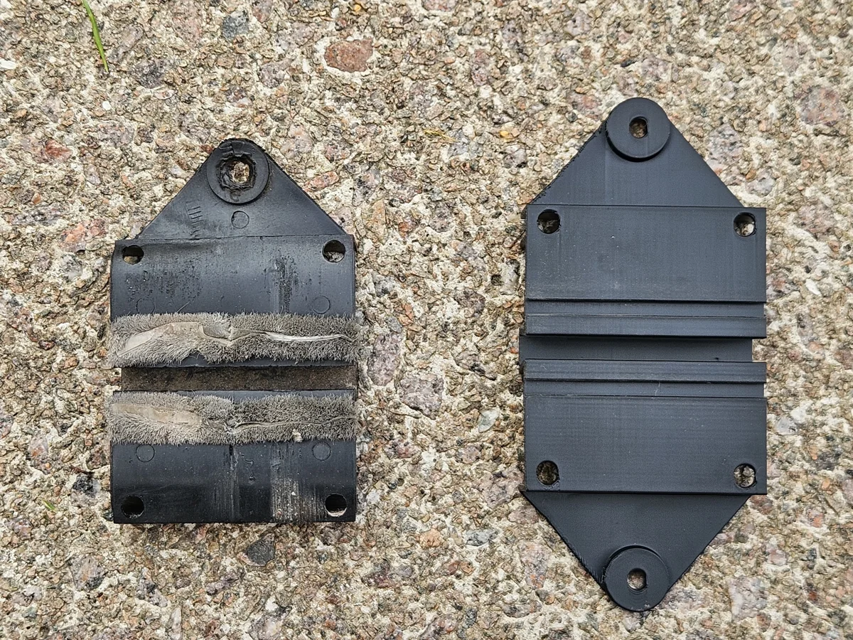 Deformed sliding-door cabinet fitting with brush strips beside the newly printed replacement components.
